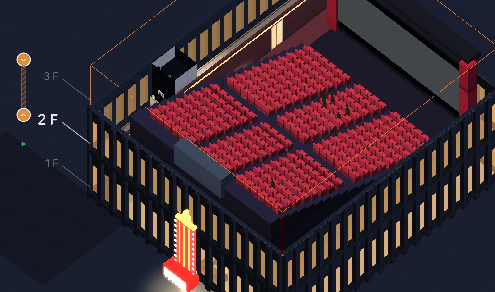 A cinema auditorium with tiered red seats and an audience